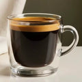Glass mug with a red eye drink with a neutral background